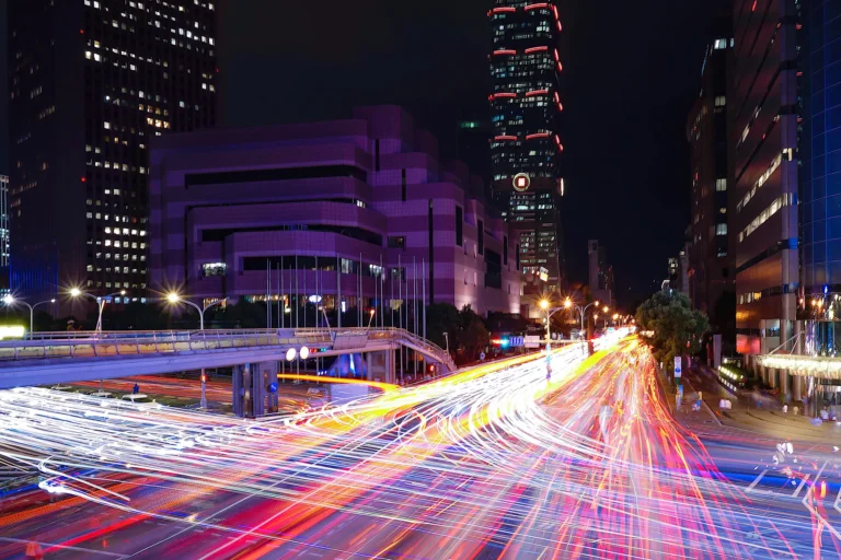 light-trails-city-street-by-buildings-night